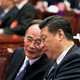 President Xi Jinping speaks with Wang Qishan, who oversees his anti-graft campaign, at the 2015 “two sessions.”
